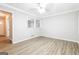 Living room with hardwood floors and a view to the entryway at 7325 Czar Pl, Riverdale, GA 30296
