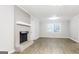 Living room with fireplace and hardwood floors at 7325 Czar Pl, Riverdale, GA 30296