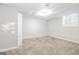 Finished basement room with neutral walls and carpet at 7325 Czar Pl, Riverdale, GA 30296