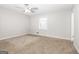 Bright bedroom with neutral walls and carpet flooring at 7325 Czar Pl, Riverdale, GA 30296