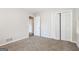 Bright bedroom with neutral carpeting and built-in closet at 7325 Czar Pl, Riverdale, GA 30296