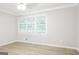 Bedroom with wood-look floors and large window with blinds at 7325 Czar Pl, Riverdale, GA 30296