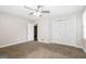 Spacious bedroom with double door closet and ceiling fan at 7325 Czar Pl, Riverdale, GA 30296