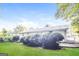 Landscaped backyard with a patio and lush greenery at 7325 Czar Pl, Riverdale, GA 30296