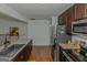 Updated kitchen with stainless steel appliances at 825 S Bethany Rd, Locust Grove, GA 30248