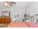 Bedroom with dresser and access to bathroom at 825 S Bethany Rd, Locust Grove, GA 30248