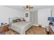 King-size bed, ceiling fan, and neutral color palette in this bedroom at 825 S Bethany Rd, Locust Grove, GA 30248