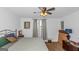 Spacious bedroom with king-size bed and ceiling fan at 825 S Bethany Rd, Locust Grove, GA 30248