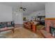 Open living room with hardwood floors, a fireplace and kitchen views at 825 S Bethany Rd, Locust Grove, GA 30248