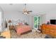 Bright bedroom with ceiling fan and large window at 825 S Bethany Rd, Locust Grove, GA 30248
