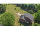 Aerial view of brick house with large backyard and trees at 825 S Bethany Rd, Locust Grove, GA 30248