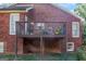 Elevated deck with brick railings offering an outdoor entertaining space at 825 S Bethany Rd, Locust Grove, GA 30248