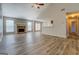 Living room with fireplace, vaulted ceiling and laminate flooring at 156 Buddy Blvd, Mcdonough, GA 30252