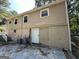 Rear view of house with access door and AC units at 245 Argus Nw Cir, Atlanta, GA 30331