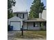 House exterior, featuring a garage and front yard at 602 Pine Tree Trl, College Park, GA 30349