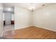 Simple dining area with hardwood floors and chandelier at 602 Pine Tree Trl, College Park, GA 30349
