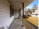Covered porch with railing, overlooking the front yard at 602 Pine Tree Trl, College Park, GA 30349