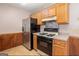 Kitchen with stainless steel appliances and wood cabinets at 602 Pine Tree Trl, College Park, GA 30349