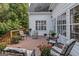 Relaxing deck with seating area and wood flooring at 65 Northwood Springs Dr, Oxford, GA 30054