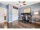 Home office with hardwood floors, gray walls, and a large desk at 3045 Rivermont Way, Roswell, GA 30076