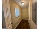 Laundry room with wood flooring and hanging rack at 2311 Amber Way, Decatur, GA 30032
