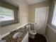 Bathroom with granite countertop and a toilet at 2311 Amber Way, Decatur, GA 30032