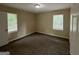 Well-lit bedroom with two windows and carpet at 2311 Amber Way, Decatur, GA 30032