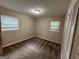 Simple bedroom with carpet flooring, neutral walls, and two windows at 3188 Convair Ln, Decatur, GA 30032
