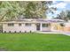 Ranch-style home with updated exterior and landscaping at 3188 Convair Ln, Decatur, GA 30032