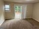 Living room with sliding glass door leading to a deck at 3188 Convair Ln, Decatur, GA 30032