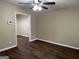 Living room with dark laminate flooring and neutral walls at 3188 Convair Ln, Decatur, GA 30032