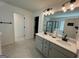 Double vanity bathroom with modern finishes and ample counter space at 844 Venture Sw Way, Atlanta, GA 30331