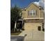Two-story house with neutral siding, stone accents, and a two-car garage at 844 Venture Sw Way, Atlanta, GA 30331