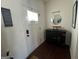 Front entry with hardwood floors, a mirror, and console table at 844 Venture Sw Way, Atlanta, GA 30331