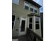 Home's back elevation, showcasing a deck and multiple windows at 844 Venture Sw Way, Atlanta, GA 30331