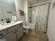 Full bathroom with tub shower combo and updated vanity at 844 Venture Sw Way, Atlanta, GA 30331