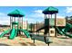 Community playground with two play structures, slides, and a bench at 116 Jacoby Dr # 112, Fairburn, GA 30213