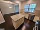 Kitchen island with granite countertop, stainless steel appliances, and dark hardwood floors at 1656 Woodbridge Ne Ln, Atlanta, GA 30329