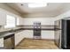 Well-equipped kitchen with white cabinets and granite countertops at 2422 Miller Oaks Cir, Decatur, GA 30035