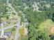 Aerial view of a house nestled in a wooded neighborhood at 3142 Brooks Dr, Snellville, GA 30078