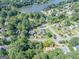 Aerial view of house and neighborhood, showing a large backyard and lake nearby at 3142 Brooks Dr, Snellville, GA 30078