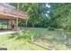Large backyard with deck, raised garden beds and wooded area at 3142 Brooks Dr, Snellville, GA 30078
