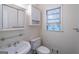 Clean bathroom with a pedestal sink and medicine cabinet at 3142 Brooks Dr, Snellville, GA 30078