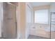 Bathroom with a shower/tub combo and updated tile at 3142 Brooks Dr, Snellville, GA 30078