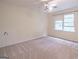 Bright bedroom with ceiling fan and window coverings at 3142 Brooks Dr, Snellville, GA 30078