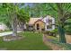 Two-story house with stone accents and a manicured lawn at 3142 Brooks Dr, Snellville, GA 30078