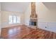 Living room with a large stone fireplace and hardwood floors at 3142 Brooks Dr, Snellville, GA 30078