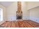 Living room with stone fireplace and hardwood floors at 3142 Brooks Dr, Snellville, GA 30078