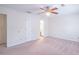 Large main bedroom with carpet, ceiling fan, and ensuite bathroom at 3142 Brooks Dr, Snellville, GA 30078