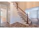 Open staircase with wooden railing and tile flooring at 3142 Brooks Dr, Snellville, GA 30078